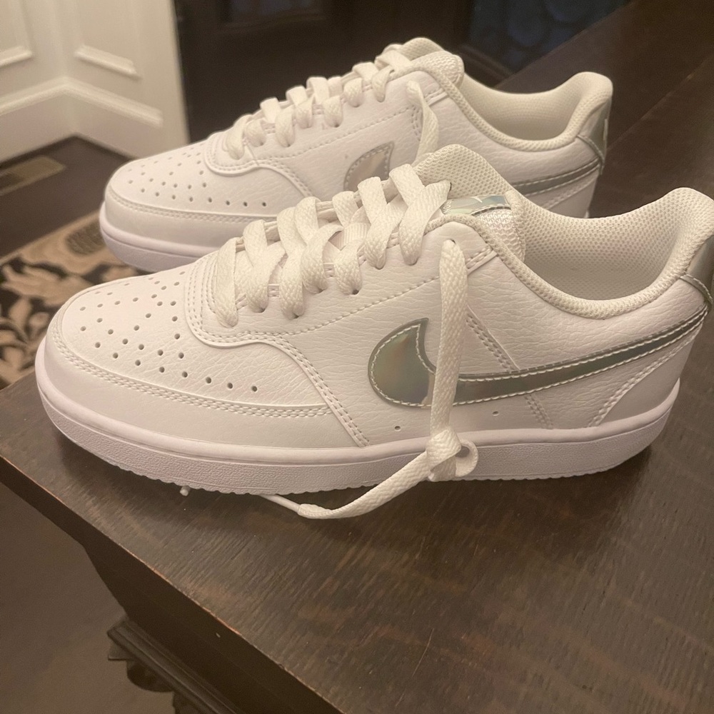 Nike Court Vision sneakers with a silver metallic swoosh
